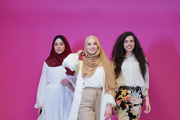 Image showing muslim women in fashionable dress isolated on pink