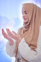 Image showing beautiful muslim woman making traditional prayer to God