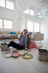 Image showing Mother and little girl daughter playing with jewelry  at home