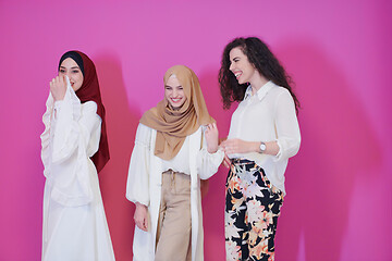 Image showing muslim women in fashionable dress isolated on pink