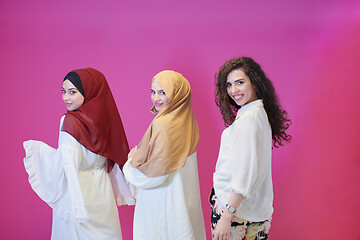 Image showing muslim women in fashionable dress isolated on pink