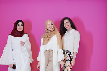 Image showing muslim women in fashionable dress isolated on pink