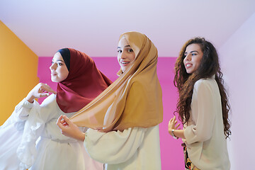 Image showing muslim women in fashionable dress isolated on pink