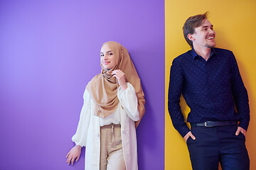 Image showing portrait of young muslim couple isolated on colorful background