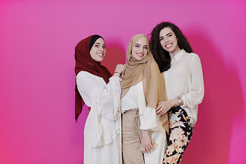 Image showing muslim women in fashionable dress isolated on pink