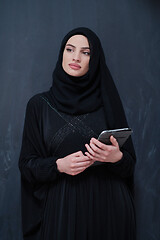 Image showing young modern muslim business woman using tablet computer