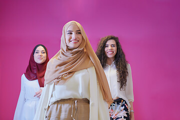 Image showing muslim women in fashionable dress isolated on pink