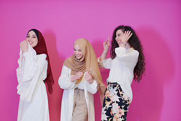 Image showing muslim women in fashionable dress isolated on pink