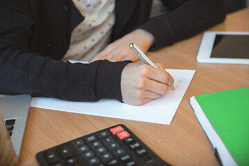 Image showing Caucasian entrepreneur, businessman, manager working concentrated in office