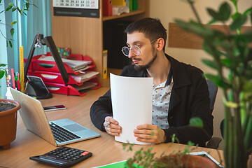 Image showing Caucasian entrepreneur, businessman, manager working concentrated in office