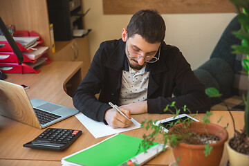 Image showing Caucasian entrepreneur, businessman, manager working concentrated in office