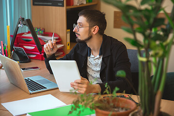 Image showing Caucasian entrepreneur, businessman, manager working concentrated in office