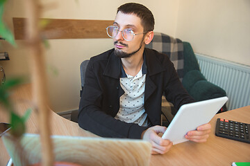 Image showing Caucasian entrepreneur, businessman, manager working concentrated in office