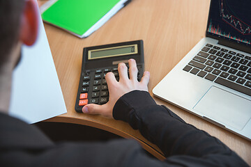 Image showing Caucasian entrepreneur, businessman, manager working concentrated in office