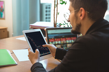 Image showing Caucasian entrepreneur, businessman, manager working concentrated in office