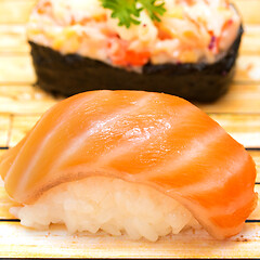 Image showing Japanese Salmon Sushi Shows Oriental Food And Delicious 