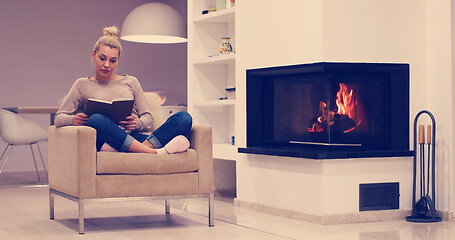 Image showing beautiful woman at home reading book