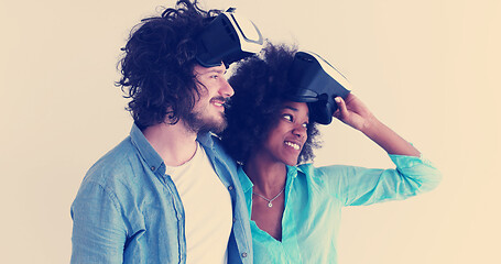 Image showing multiethnic couple getting experience using VR headset glasses