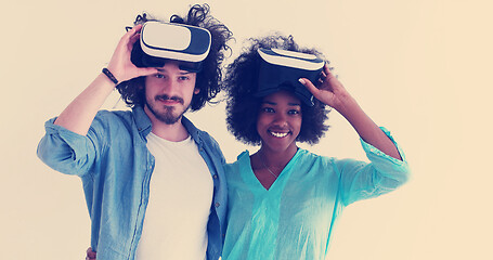 Image showing multiethnic couple getting experience using VR headset glasses