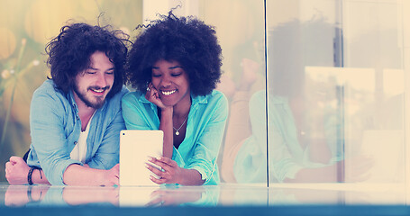 Image showing Couple relaxing together at home with tablet computer