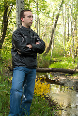 Image showing Man Relaxing By A Stream