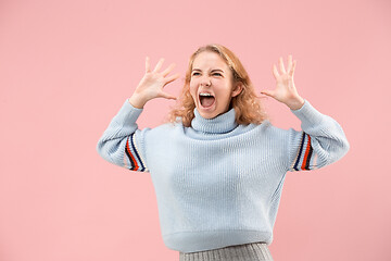 Image showing Beautiful woman looking suprised isolated on pink