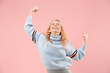 Image showing Winning success woman happy ecstatic celebrating being a winner. Dynamic energetic image of female model