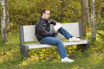 Image showing Man Reading on a Bench