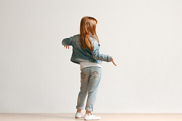 Image showing Full length portrait of cute little kid in stylish jeans clothes