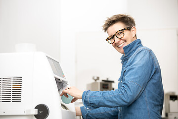 Image showing woman hone the edge of the eyeglasses