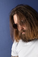 Image showing bearded young man with long hair and sunglasses