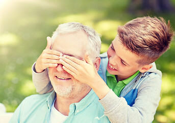 Image showing grandfather and grandson playing at summer park