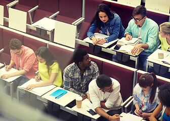 Image showing group of students with notebooks at lecture hall