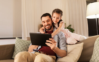 Image showing father and daughter with tablet computer at home