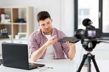 Image showing male video blogger with keyboard videoblogging