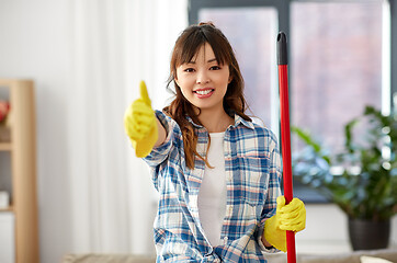 Image showing asian woman cleaning home and showing thumbs up