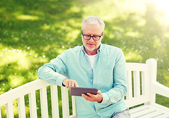 Image showing senior man with tablet pc at summer park