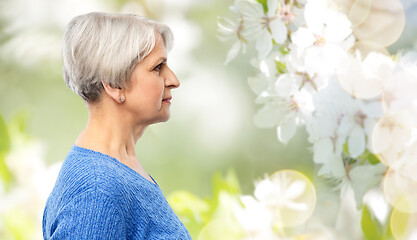 Image showing portrait of senior woman in blue sweater over grey