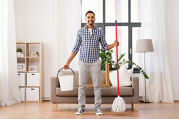 Image showing indian man with mop and bucket cleaning at home