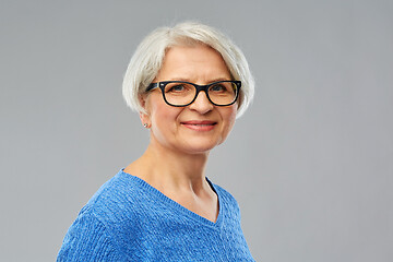 Image showing portrait of senior woman in glasses over grey