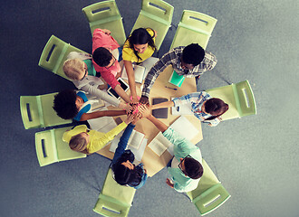 Image showing group of international students making high five