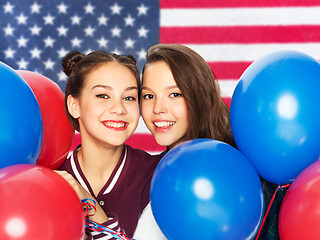 Image showing teenage girls with balloons over american flag