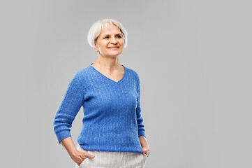 Image showing portrait of smiling senior woman in blue sweater