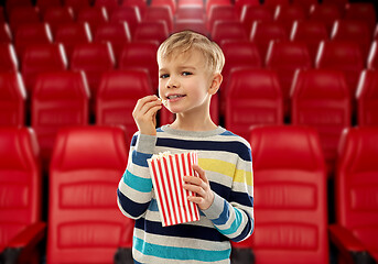 Image showing smiling boy eating popcorn at movie theater