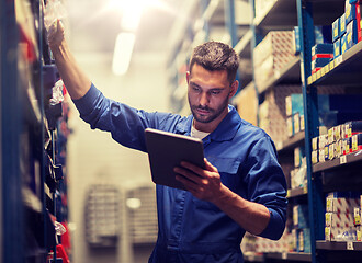 Image showing auto mechanic or smith with tablet pc at workshop