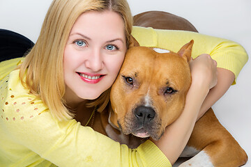 Image showing Girl with amstaff dog