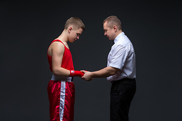 Image showing Referee checking young boxer