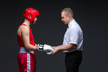 Image showing Referee checking young boxer