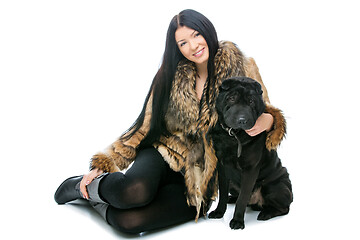 Image showing Girl with black shar pei dog