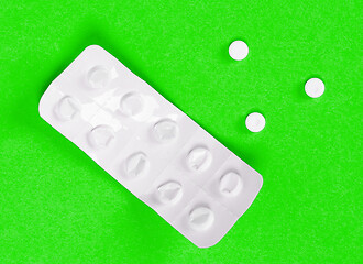 Image showing Pill strip on green background